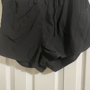 Women’s shorts lined tied waist lie flat against stomach .